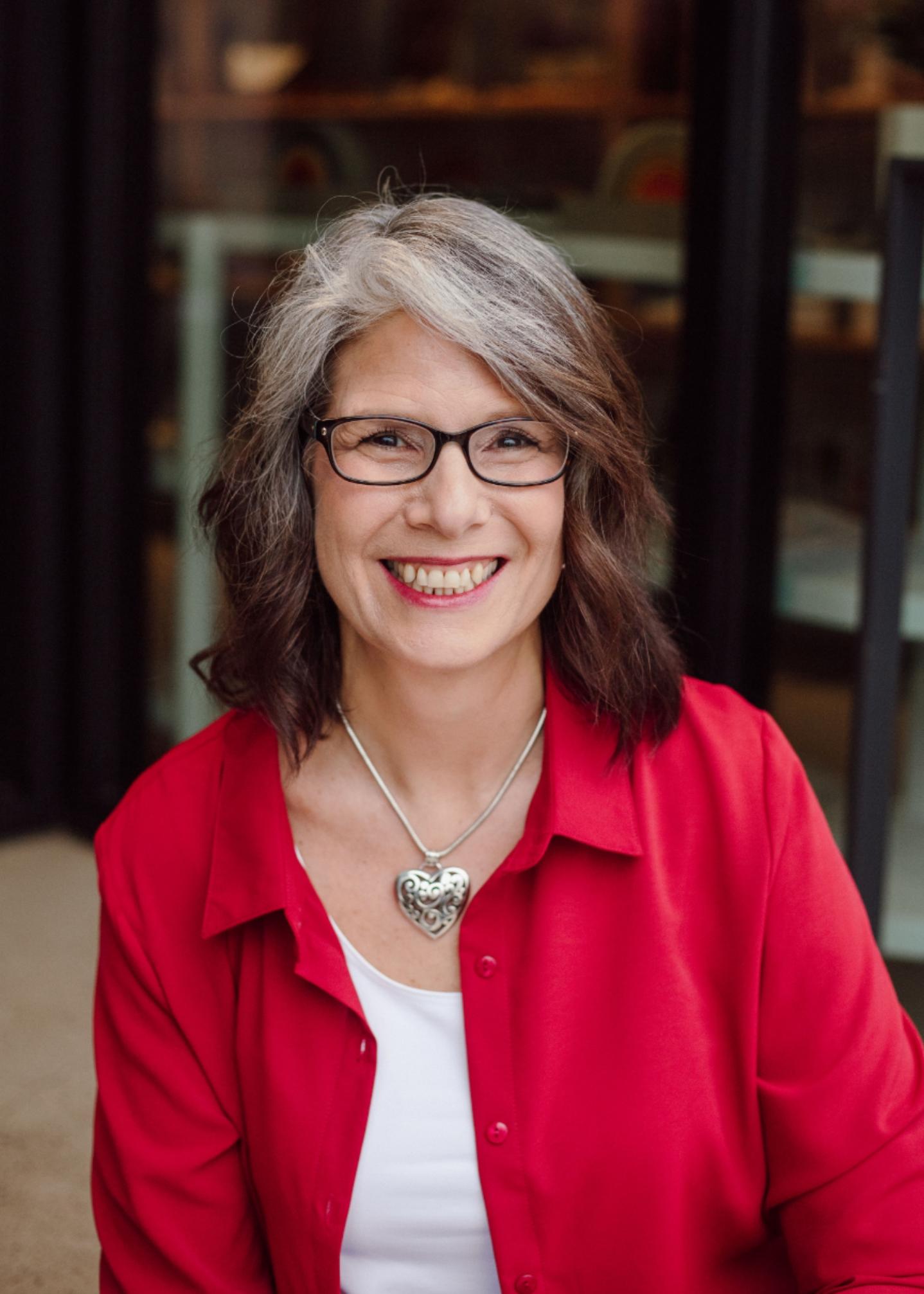 Business owner (Natalie Weiss) in professional attire
